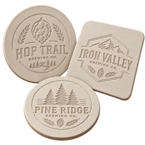 Brewery debossed coasters with custom brewery logo samples on a transparent background